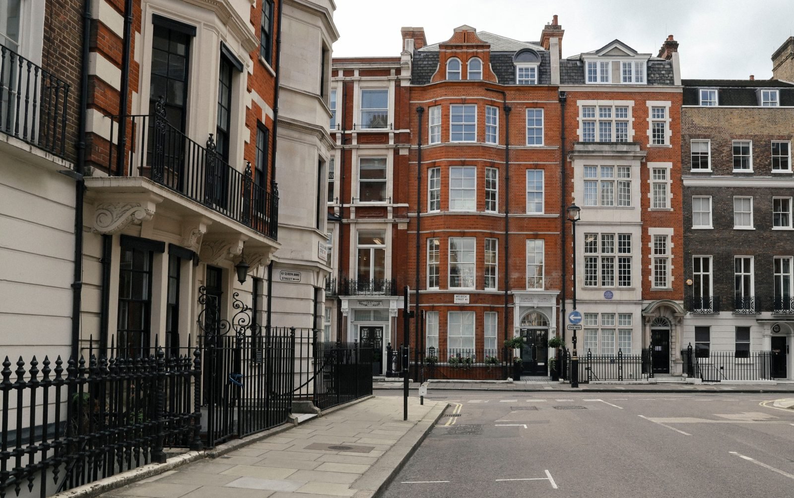 Red-brick and stucco townhouses on a quiet Marylebone street in central London